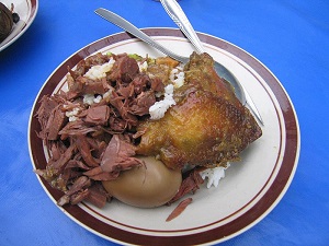 Gudeg,(left), the unripe jackfruit curry in a reddish color acquired from the teak leaf, a specialty of Yogyakarta in Java