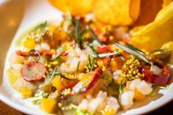 Kanapachi tartare: persimmon, Calabrian pepper, brussel sprouts, charred vegetable broth, yam chips